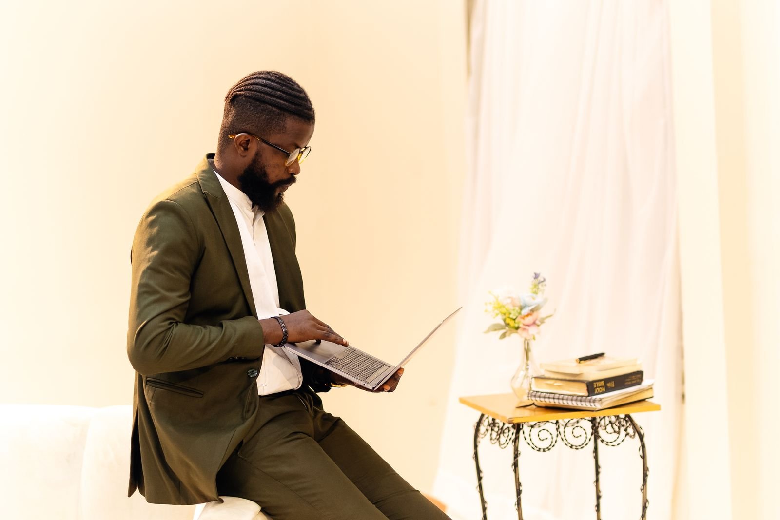 Nigerian digital marketer working on a laptop in a Lagos office, reviewing search and traffic data