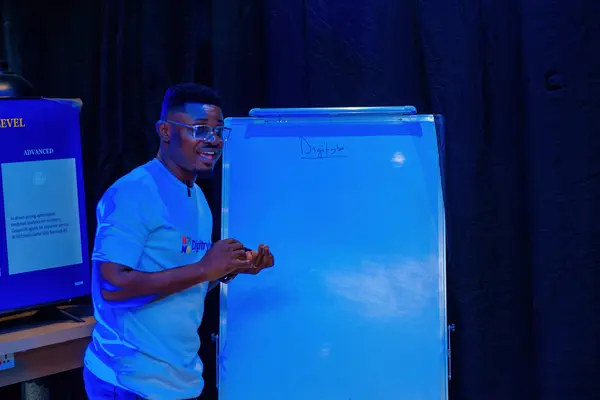 digiTrybe trainer explaining search results changes on a whiteboard at a Lagos training session