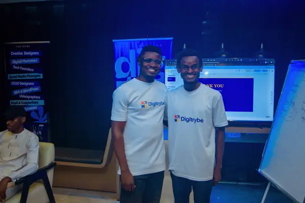 Two digiTrybe members in branded shirts after a digital marketing training session in Nigeria
